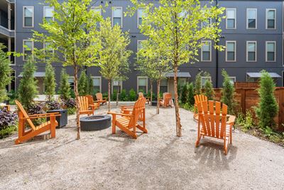 Lush Greenery and Adirondack Chairs throughout a Courtyard